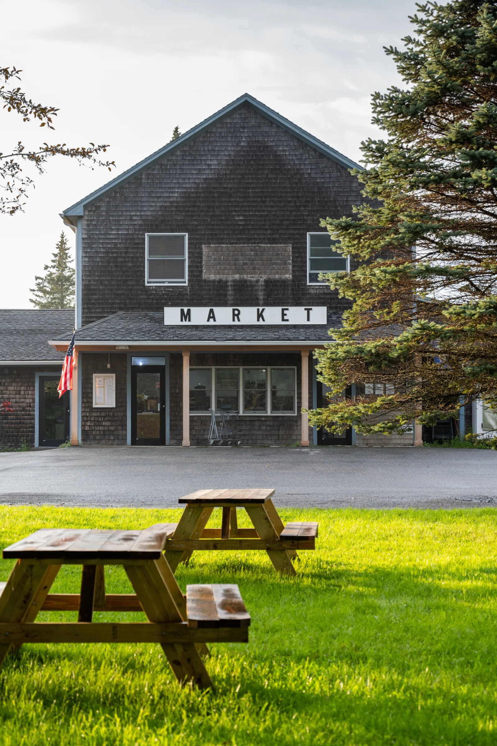 The Market building on North Haven with picnic tables on the lawn